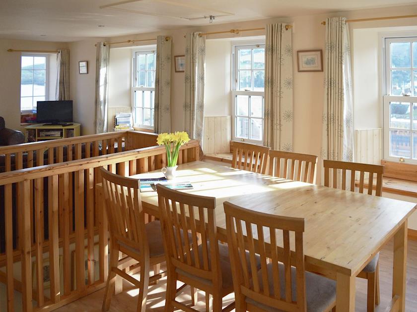 Dining area with wonderful views and french doors to decked terrace | Cross Garden Cottage, Salcombe