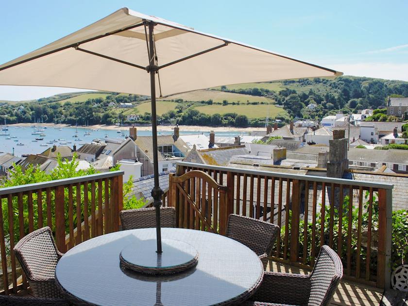 Large decked area to side with outdoor furniture Gravelled sitting area to the rear with BBQ | Cross Garden Cottage, Salcombe