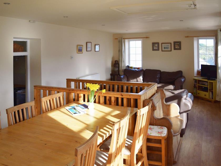 Dining area with wonderful views and french doors to decked terrace | Cross Garden Cottage, Salcombe