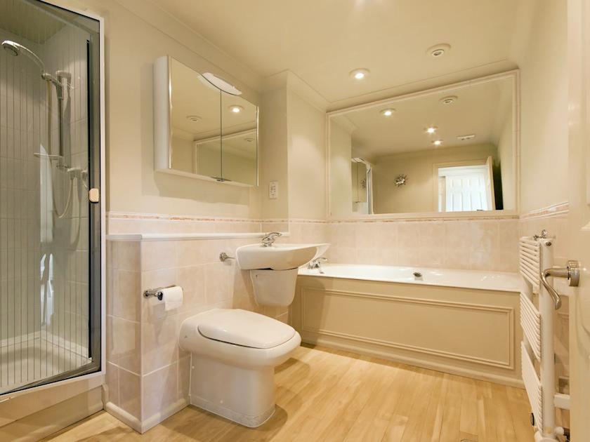 Bathroom with bath, shower cubicle, basin and WC | St Elmo Court 7, Salcombe