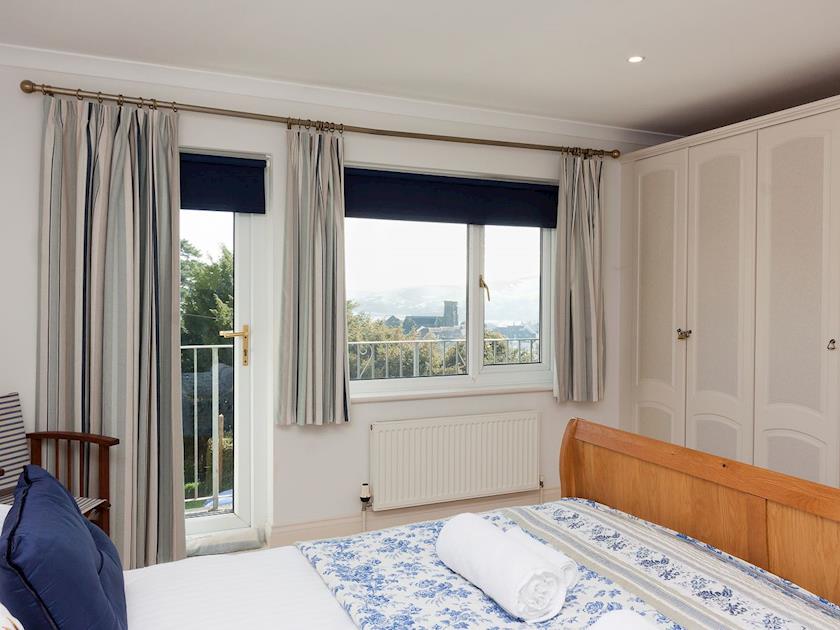 Double bedroom with door to balcony and ensuite shower room | End House, Salcombe