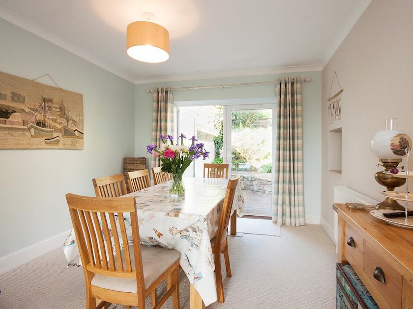 Elegant dining area with access to garden | End House, Salcombe