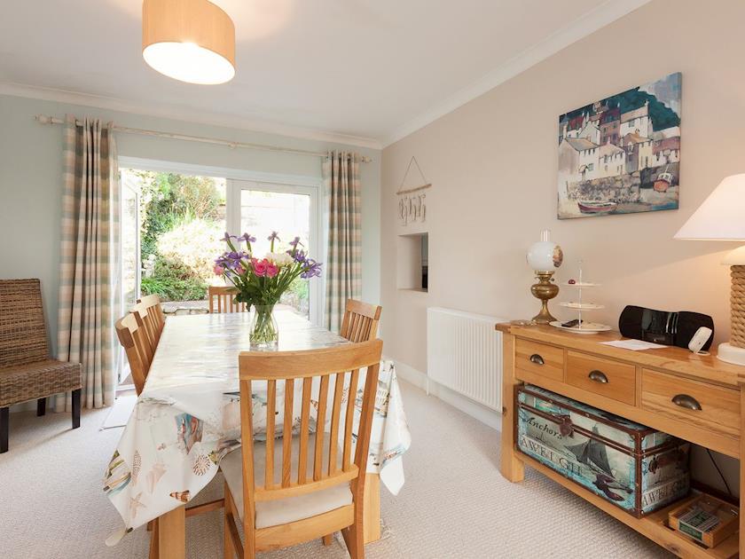 Dining area with patio doors to rear terrace and garden | End House, Salcombe