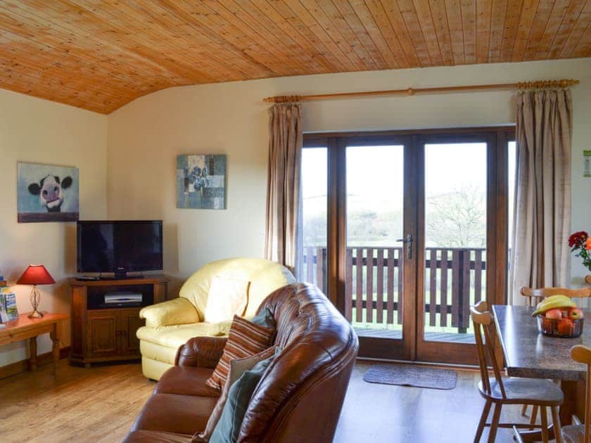 Living area with french doors to verandah | Brook View - Bryn Thomas Lodges, Near Llandrindod Wells