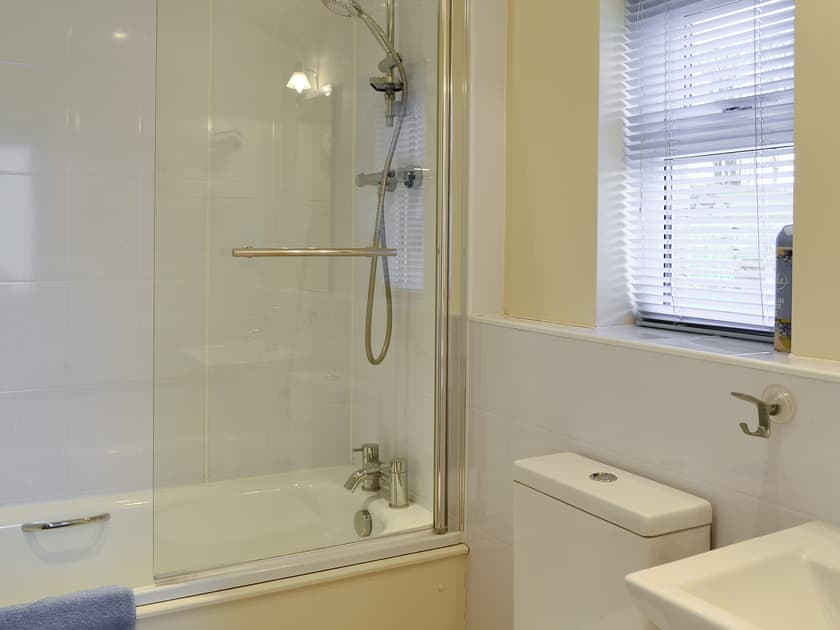 Bathroom with shower over bath | Foulden Hill Farm Cottage, Foulden