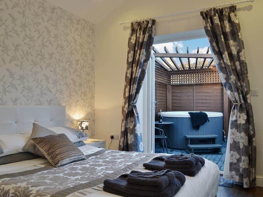 Double bedroom to hot tub | Oswald Lodge, Llanon, nr. Aberystwyth