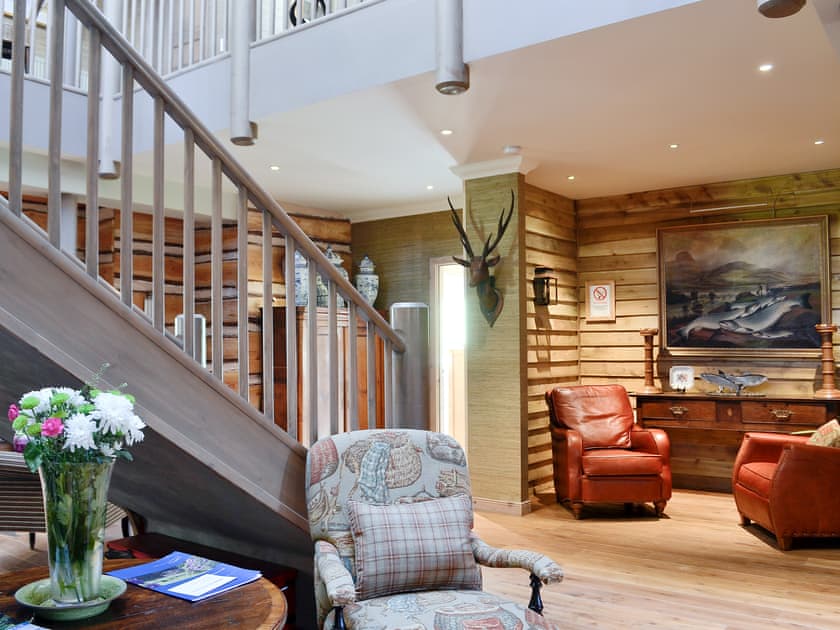 Stylish entrance hallway and staircase | River Lodge - Ness Castle Estate, Inverness