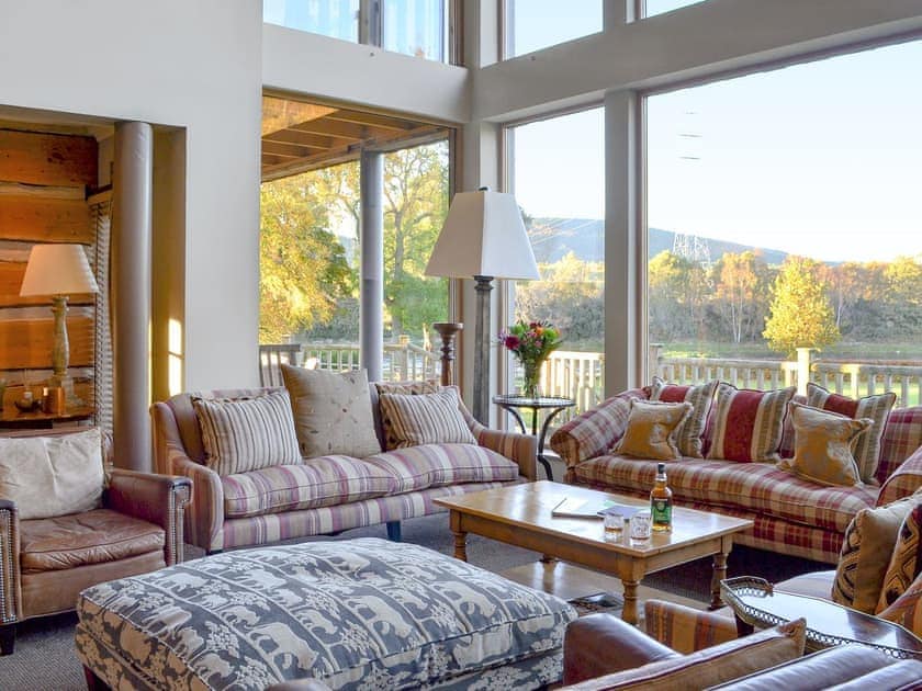 Enjoy the river views from the comfort of the spacious living room | River Lodge - Ness Castle Estate, Inverness