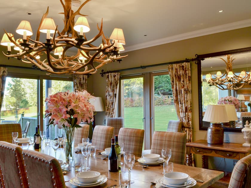The grand dining area perfect for family gatherings | River Lodge - Ness Castle Estate, Inverness