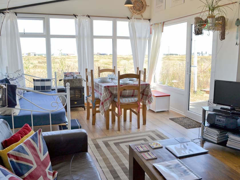 Living room with single day bed/dining area | Les Quatre Vents, Dungeness