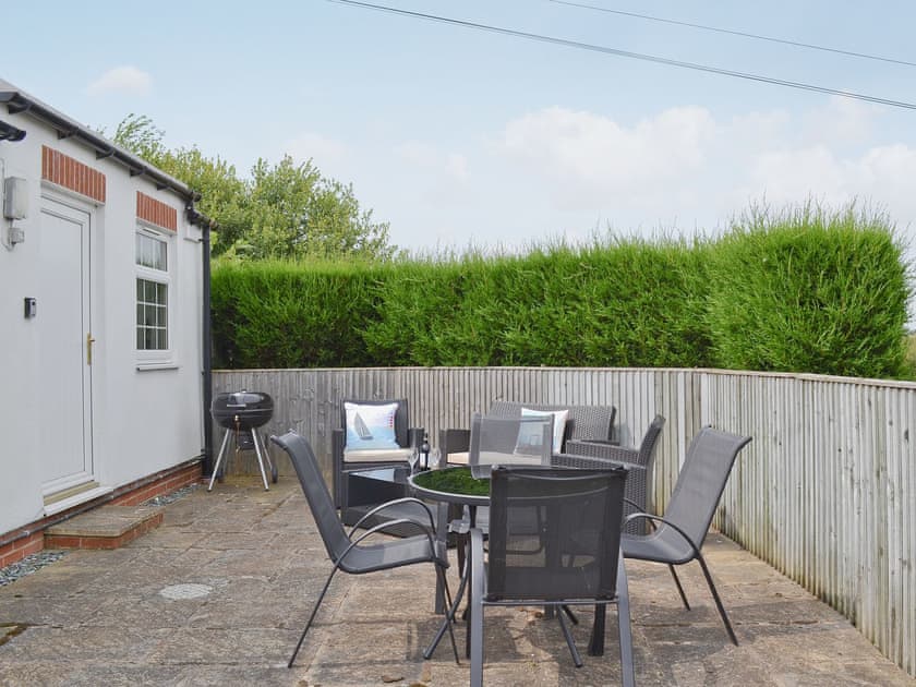 Sitting-out-area | Newbiggin Gardens - Magpie Cottage, Filey