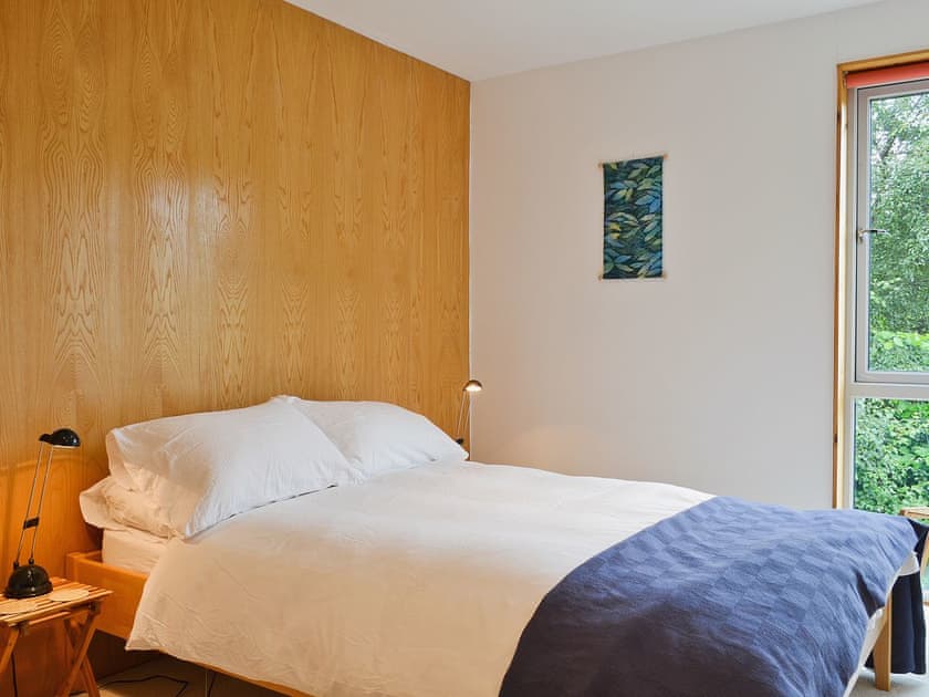 5ft double bed in wood-panelled bedroom | West Bothy at Cluain Ghrianach, Laga, near Acharacle