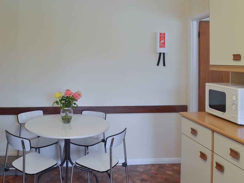 Spacious contemporary dining area | Honeysuckle Bungalow - Devon Palms, Maidencombe, near Torquay