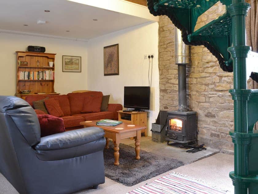 Cosy lounge area with wood-burner | Beck House, Grisedale near Hawes