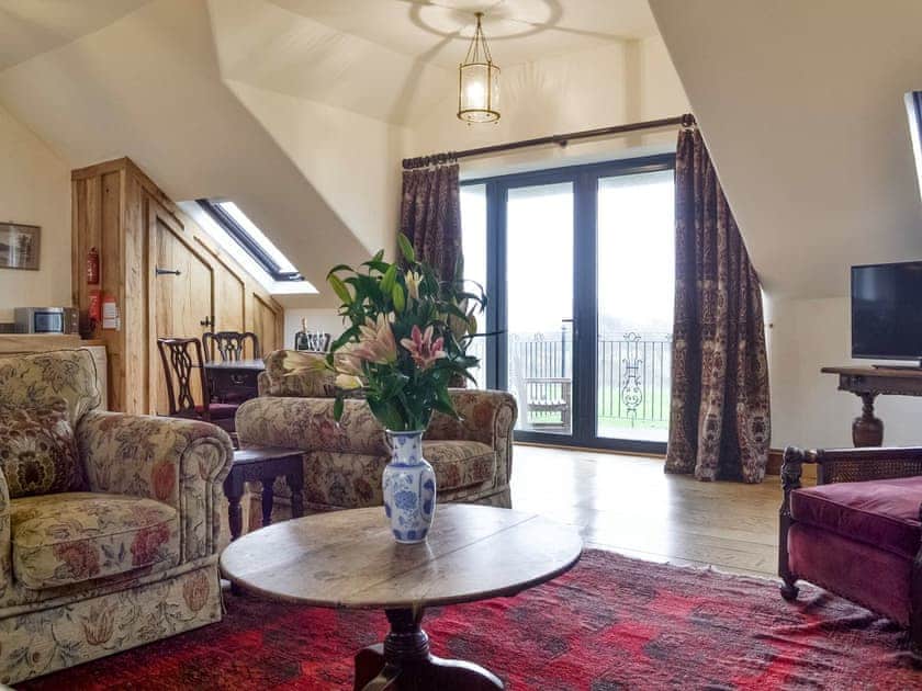 Open-plan room with patio door to balcony | The Granary - High Thorn Farm Cottages, Selside near Kendal