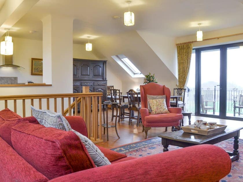 Open-plan designed living space with patio door to balcony | The Corn Store - High Thorn Farm Cottages, Selside near Kendal