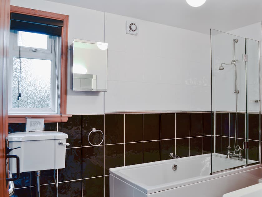 Stylish bathroom with shower over the bath | Horsepark Cottage, Gatehouse of Fleet