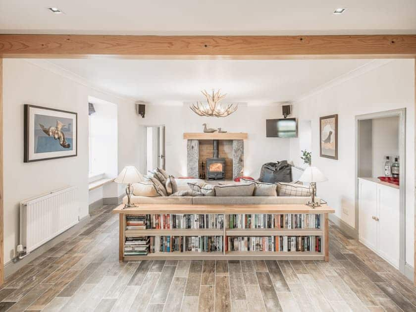 The bright and airy open plan living area with wood-burning stove | Diamonds Laggan - Barwhillanty Estate, Parton, near Castle Douglas