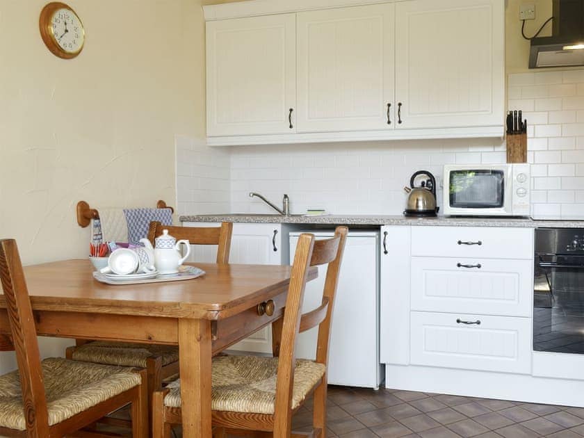 Convenient dining area and well-equipped kitchen | Garden Retreat - Periton Park Court, Minehead