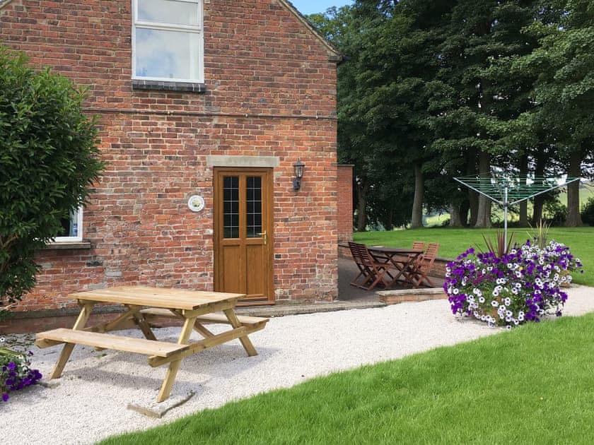 Outdoor furniture on side and rear patios | Garden Farm Cottage, Ilam, near Ashbourne