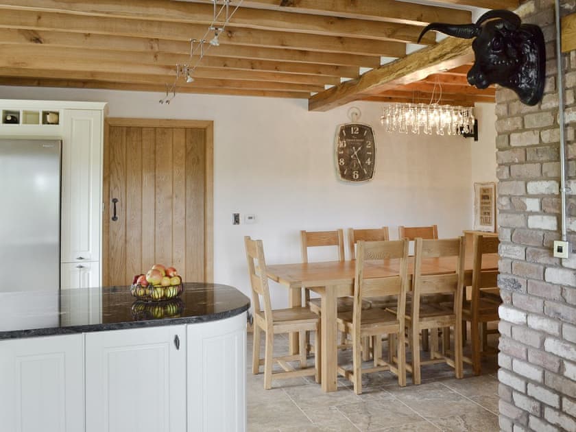 Kitchen/dining room with traditional features such as exposed brickwork | Pheasant Fields - Holly and Pines Holidays, Holywell