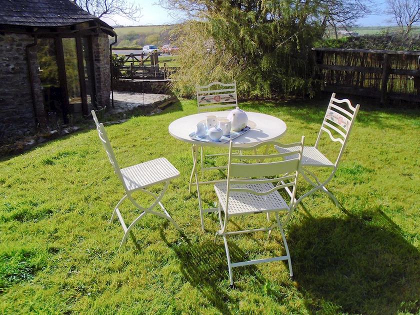 Sitting out area in the rear garden | Oak Cottage, Woolsery, near Bideford