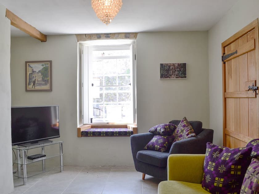 Comfortable sitting room | The Mill Farmhouse (Ty Fferm Y Felin), Llandybie, near Llandeilo