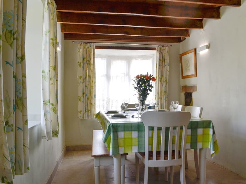 Spacious, beamed dining room | The Mill Farmhouse (Ty Fferm Y Felin), Llandybie, near Llandeilo
