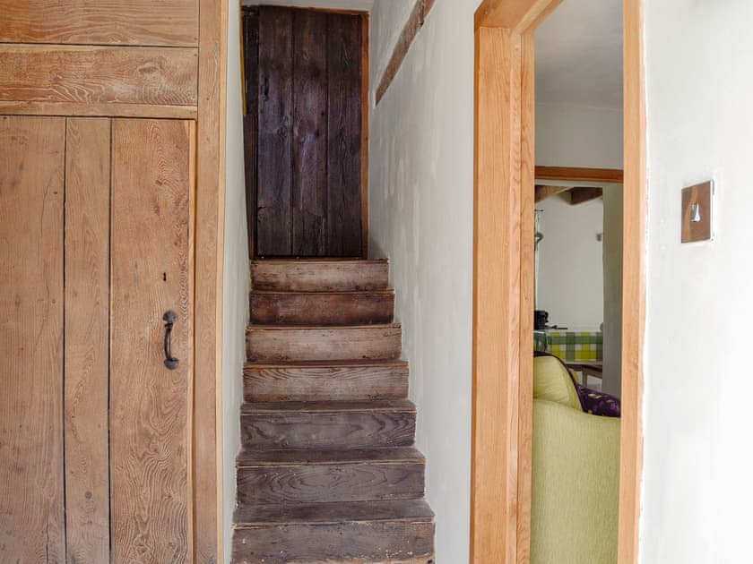 Exposed original wooden stairs | The Mill Farmhouse (Ty Fferm Y Felin), Llandybie, near Llandeilo