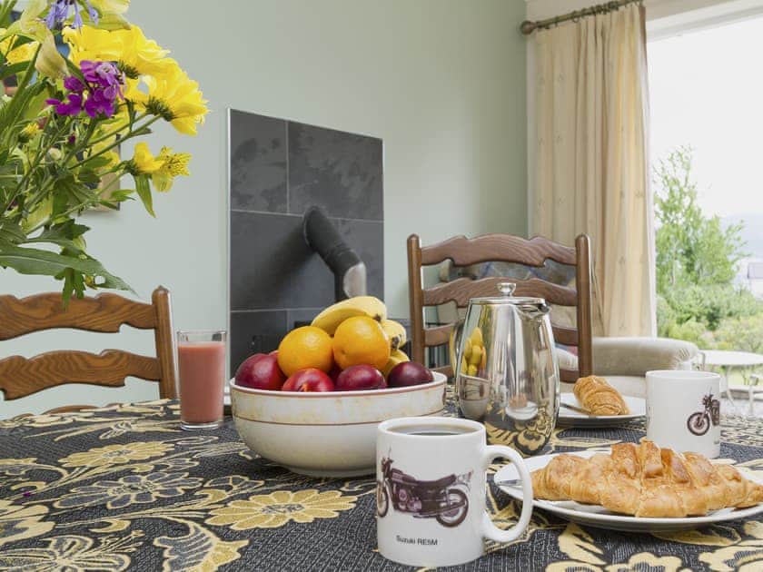 Dining room with wood-burning stove | Torfern, Corpach, near Fort William