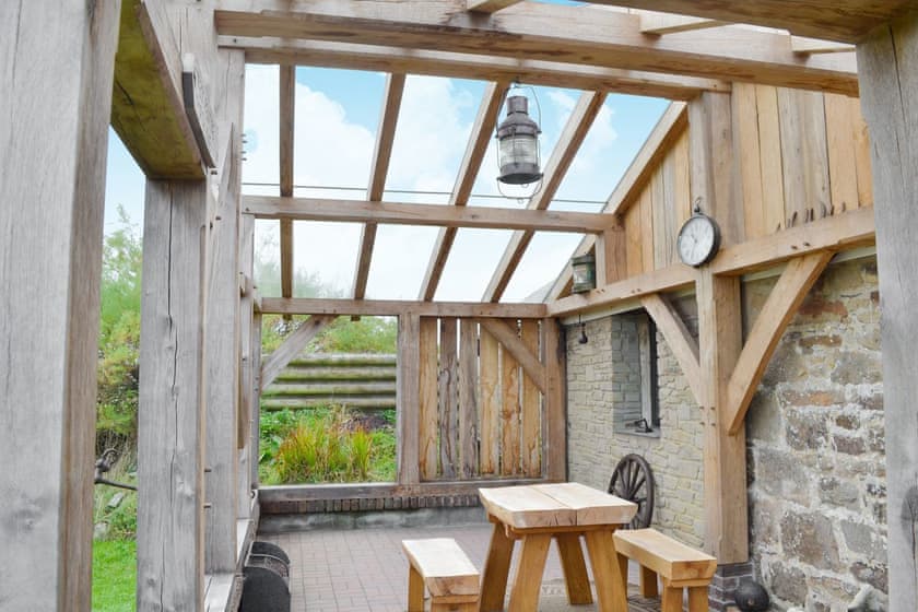 Garden room | Horseshoe Cottage - Lewannick Farm, Holywell Bay, nr. Cubert