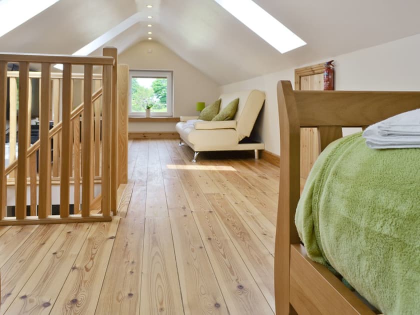 Twin bedroom and TV area | Hen Weithdy, Rhostryfan, Caernarfon