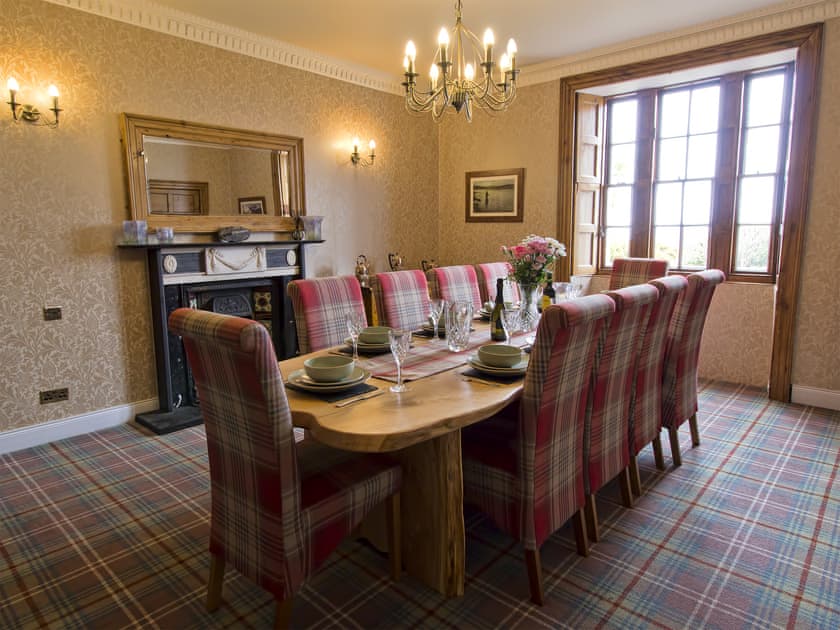 Elegant dining room with open fireplace | Drummuie House, Golspie