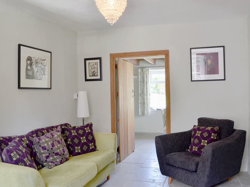 Comfortable sitting room | The Mill Farmhouse (Ty Fferm Y Felin), Llandybie, near Llandeilo