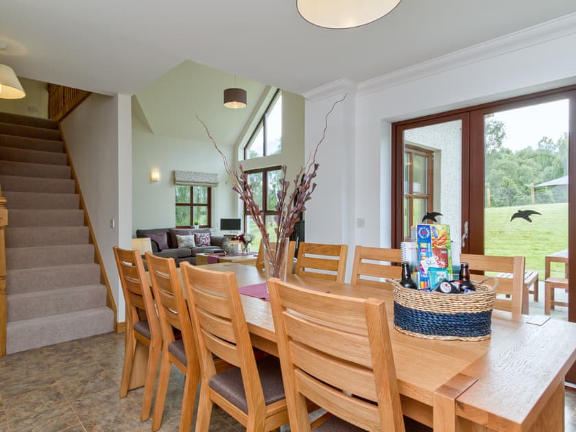 Dining area overlooking the pretty garden | Birch Corner, Aviemore