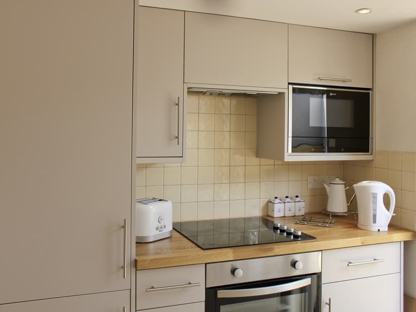 Open plan contemporary style kitchen and diner | Anchor Cottage, Deal