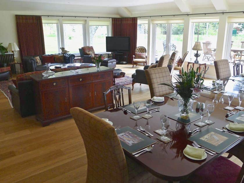 The spacious living/dining room is ideal for family get togethers | Holm Lodge, Inverness