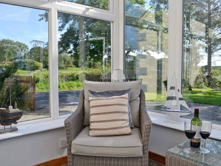 Enjoy the garden views from the comfortable conservatory | Horsepark Cottage, Gatehouse of Fleet