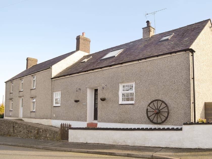 charming semi detached holiday cottage - Hen Efail on right of picture | Hen Efail, Pen-y-sarn near Amlwch