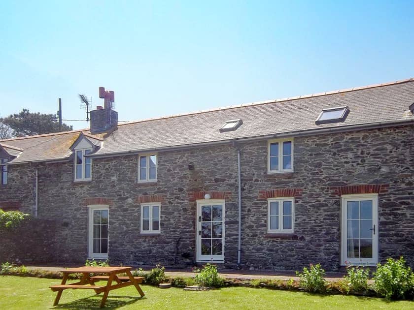 Rear of the property with large lawned garden | The Shippen, East Prawle