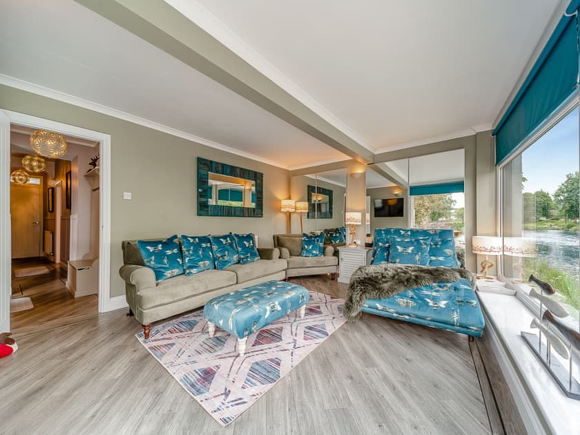 There are views both up and down the river from the living room | Creebank, Newton Stewart