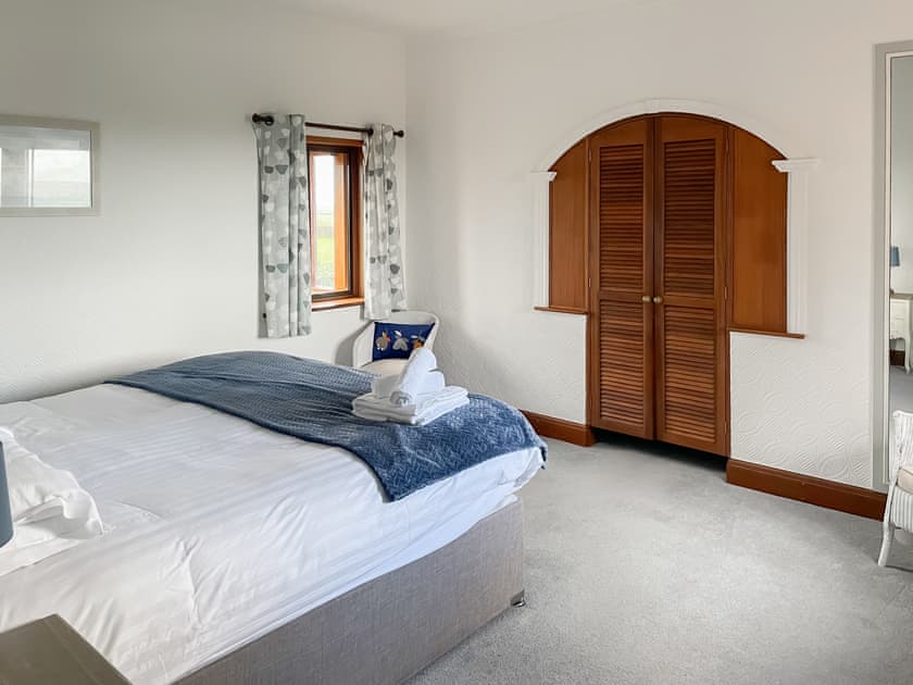 SuperKing bedroom with walk-in wardrobe | Maes Y Wawr, Felinfoel, near Kidwelly