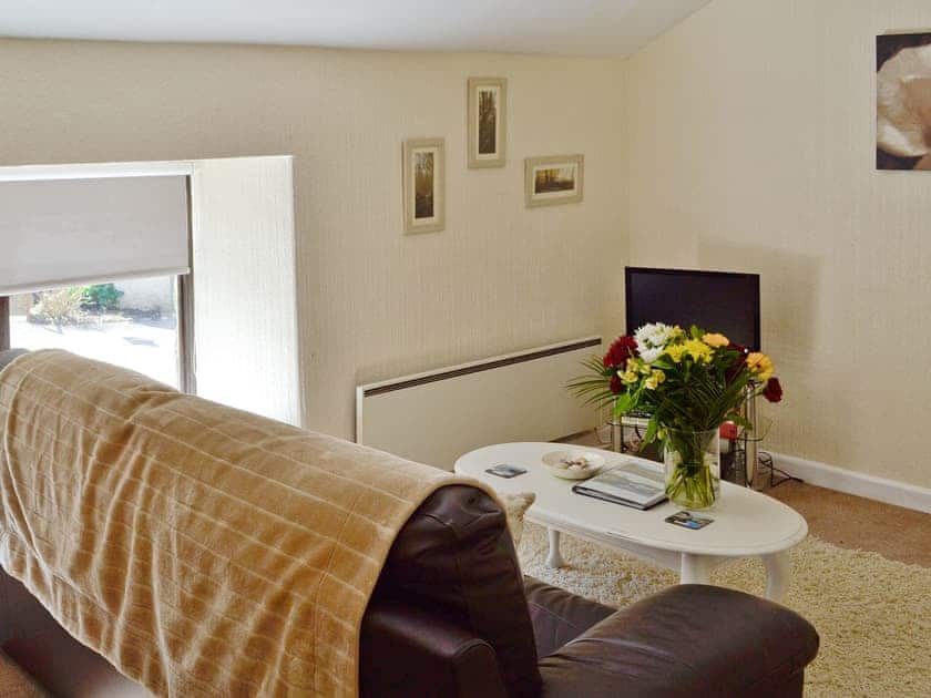 Cosy lounge area of living/dining room | Hayloft  - Rosecraddoc Manor, Near Liskeard