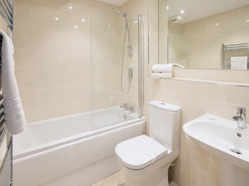 Contemporary bathroom equipped with white bath suite | Spindrift, Seahouses