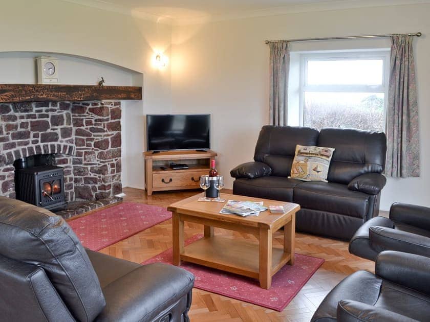 Living room with wood burning stove | Bwthyn Pereos, Cemlyn near Amlwch