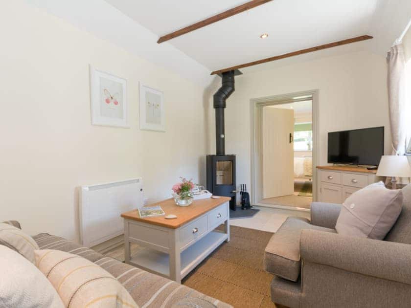 Cosy living area with wood burner | Cherry Blossom - Cherry Garth Cottages, Thornton le Dale near Pickering