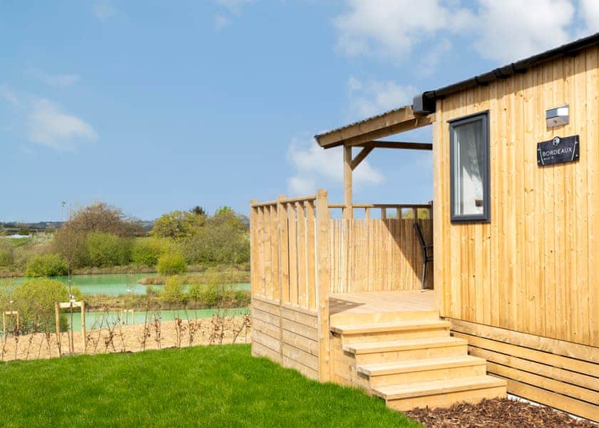 Please note: All imagery shown is a representation only. Style, decor and exact views vary by lodge | Willows Lake View 2 Bed Holiday Home - Clawford Lakes Resort and Spa, Clawton, Nr Holsworthy