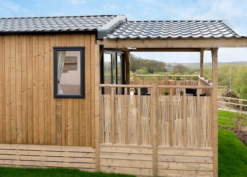 Please note: All imagery shown is a representation only. Style, decor and exact views vary by lodge | Willows Lake View 2 Bed Holiday Home - Clawford Lakes Resort and Spa, Clawton, Nr Holsworthy