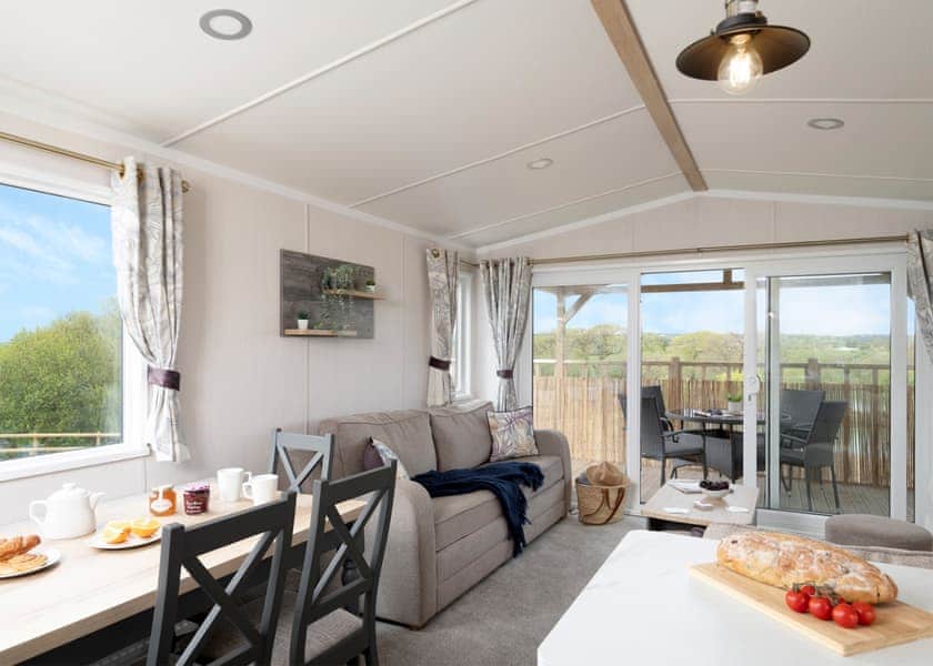 Please note: All imagery shown is a representation only. Style, decor and exact views vary by lodge | Willows Lake View 2 Bed Holiday Home - Clawford Lakes Resort and Spa, Clawton, Nr Holsworthy
