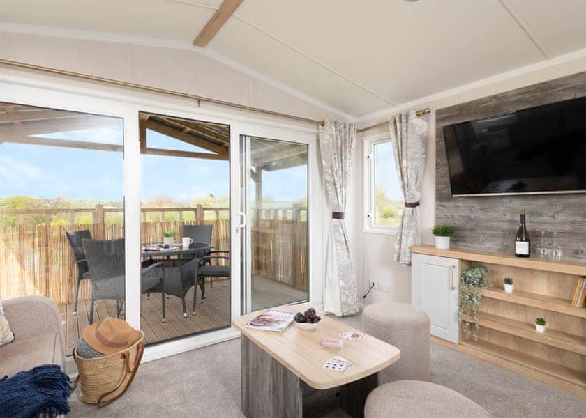Please note: All imagery shown is a representation only. Style, decor and exact views vary by lodge | Willows Lake View 2 Bed Holiday Home - Clawford Lakes Resort and Spa, Clawton, Nr Holsworthy